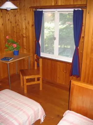 a bed with blue pillows in a bedroom at B&B Am Büel in Sevelen