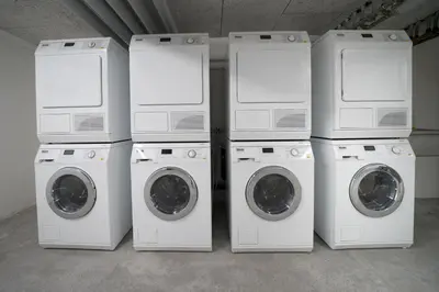 a group of four washing machines and a washer and dryer at wohnMOTEL - Hinterforst in Altstätten