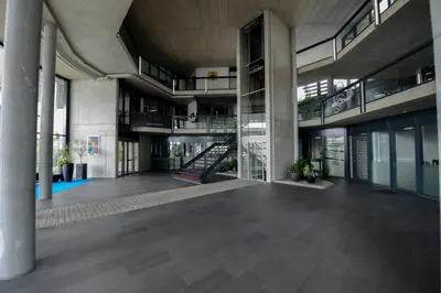 an empty lobby of a building with a staircase at Berger Zentrum in Berg