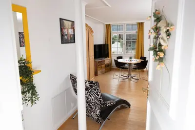 a hallway with a living room with a table at Gasthof Zur Traube in Roggwil