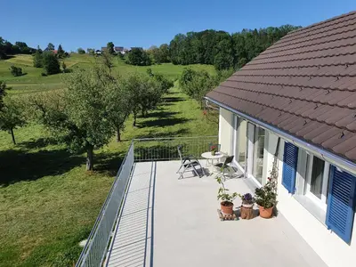 an aerial view of a house with a balcony with a patio at Sitter-Panorama in Bischofszell