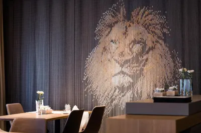 a painting of a woman on a wall in a restaurant at Landgasthof Lowen in Sulgen