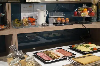 a table with some food on top of a counter at Bodenseehotel Weisses Rössli in Staad