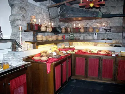 a kitchen with a bunch of food on the counter at Hotel Garni Sonne in Landschlacht Gemeinde Münsterlingen