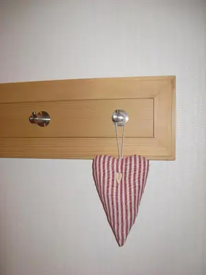 a heart object hanging from a wooden cabinet at Waldgasthaus Lehmen in Weissbad