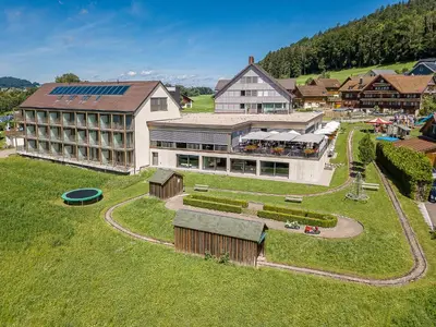 an aerial view of a resort with a building at Hotel Rössli Tufertschwil in Lütisburg