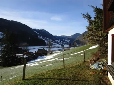 a view of a snow covered field with a river at Stofel 2078 in Unterwasser