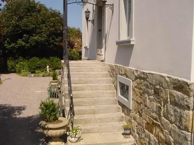 a set of stairs leading up to a building at Hotel Restaurant Belvedere in Weissbad