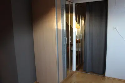 a sliding glass door in a room with a hallway at Haus Basilea in Wolfhalden