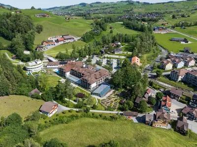 an aerial view of a building covered in snow at Hof Weissbad Health & Wellness Resort in Weissbad