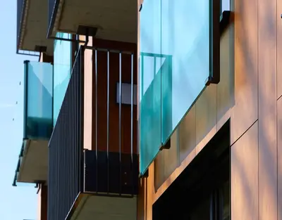 a building with glass windows on the side of it at APPADU Appartements in St. Gallen