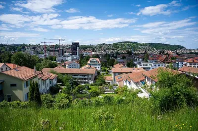 a view of a city with houses and buildings at St. Gallen Youth Hostel in St. Gallen