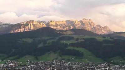 a view of a mountain range with a city at Ferienstudio Familie Fässler-Dörig in Appenzell