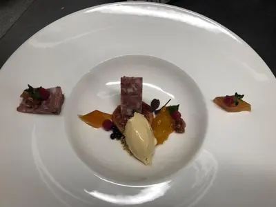 a white plate with a piece of food on it at Landgasthaus Bären in Grub