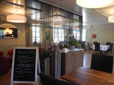 a restaurant with a table and a sign in a room at Landgasthaus Bären in Grub