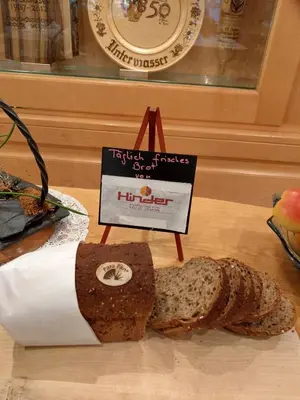 a loaf of bread sitting on a table with a sign at Gasthaus Schäfli in Alt Sankt Johann