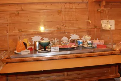 a buffet line with food on a table at Hotel Restaurant Schönau in Wildhaus