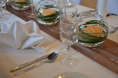 a table with two wine glasses on top of it at Hotel Buchserhof in Buchs