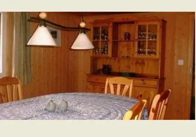 two cats sitting on a table in a kitchen at Ferienhaus Brand in Gais