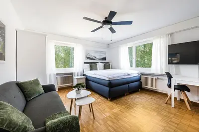 a living room with a couch and a bed at SOHO 2A !Gratis Parken, Free Parking! in Kreuzlingen