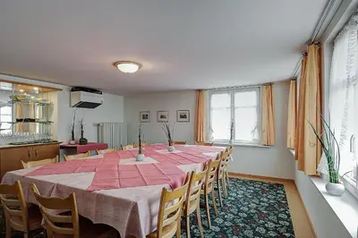 a dining room with a table and chairs at Gasthof Eisenbahn in Weinfelden