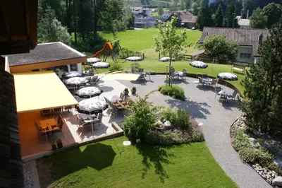 an aerial view of a patio with tables and umbrellas at Landgasthof Sternen in Bühler