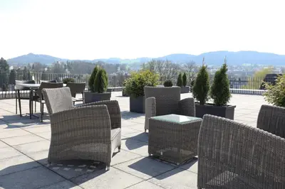 a group of chairs and a table on a patio at Uze Apartments in Uzwil SG in Uzwil