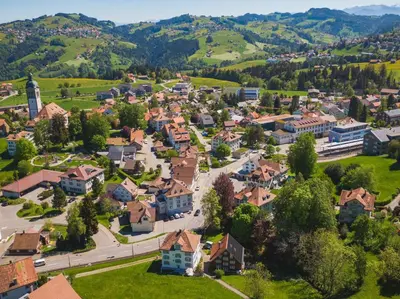 an aerial view of a small town in the mountains at Haus zur Rose, St.Gallen, Bodensee, Säntis in Speicher