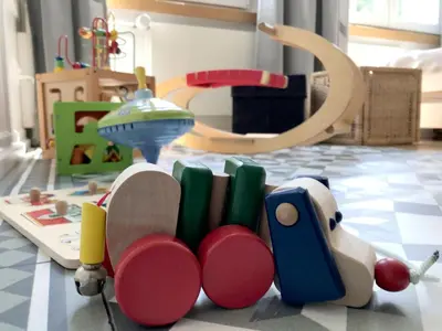 a toy train and books on a floor at Haus zur Rose, St.Gallen, Bodensee, Säntis in Speicher