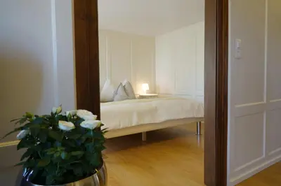 a white building with windows and a door at Haus zur Rose, St.Gallen, Bodensee, Säntis in Speicher