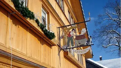 a sign on the side of a building at Hotel und Restaurant Chäseren in Schönengrund