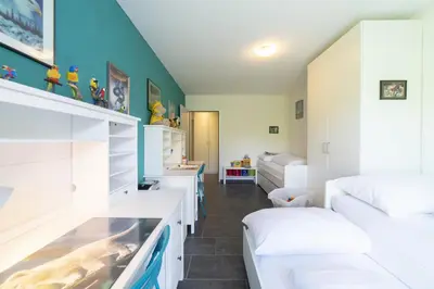 a room with two beds and a fish tank in it at Sunnewies in Wildhaus