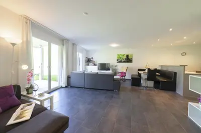 a living room with a couch and a table at Sunnewies in Wildhaus