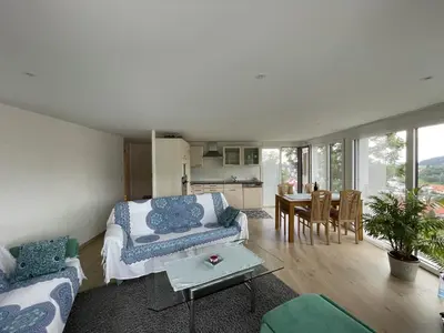 a living room with a couch and a table at Hälmli in Heiden