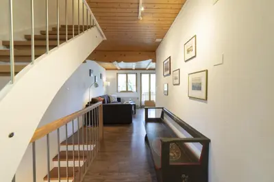 a hallway with a staircase in a house at Schönau in Wildhaus