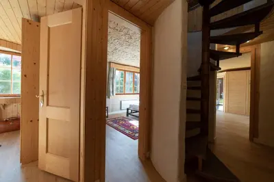 a room with a staircase in a house at Tanzhaus in Wildhaus