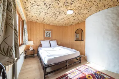 a bedroom with a bed in a room at Tanzhaus in Wildhaus