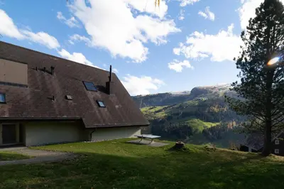 a building with a view of a mountain at Haldenblick in Unterwasser