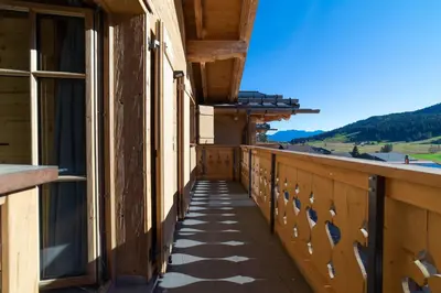 a balcony with a view of the mountains at Chalet Gamserrugg in Wildhaus
