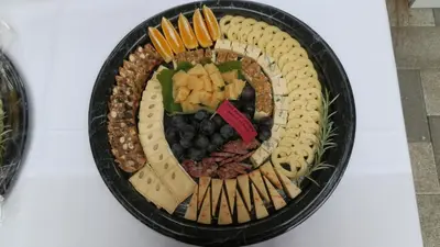 a plate of cheese and crackers on a table at Steigmatt Bauernhof- Erlebnis in Montlingen