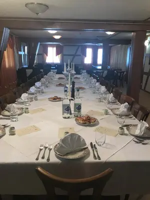a long table with plates of food on it at Hotel Restaurant Pizzeria Rotes Haus in Landschlacht Gemeinde Münsterlingen