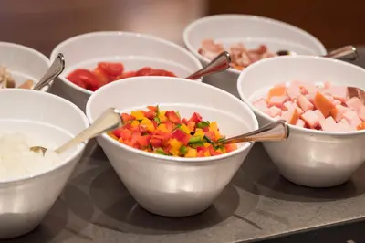 a group of bowls filled with different types of food at Einstein St. Gallen in St. Gallen