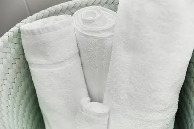 a basket filled with white toilet paper at Dom Studios in St. Gallen