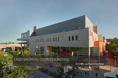 a large building with a sign in front of it at Hotel Kreuzlingen am Hafen in Kreuzlingen