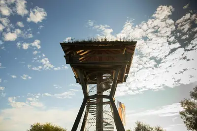 a tall observation tower with a cloudy sky in the background at Hotel Kreuzlingen am Hafen in Kreuzlingen