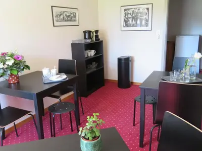 a dining room with two tables and two chairs at Landhaus an der Thur in Alt Sankt Johann