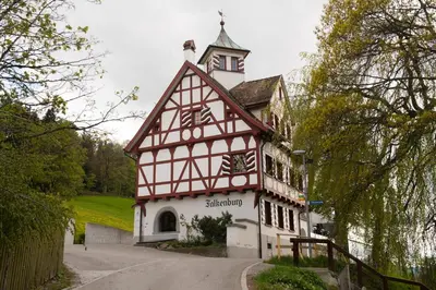 a building with a clock tower on top of it at Hotel Restaurant Falkenburg in St. Gallen