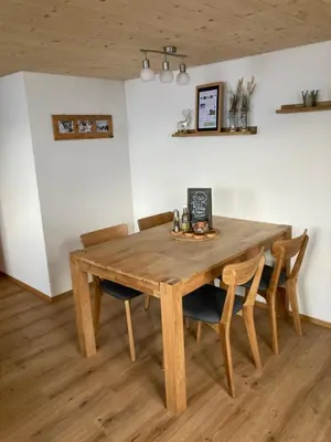 a wooden table and chairs in a room at Wies in Stein