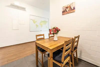 a white room with a desk and a computer in it at YELLOW INN - SIMPLE ROOMS -- OLMA Messen & Autobahn 1 Min, HSG 6 Min, Spital 7min, günstige Parkplätze in St. Gallen