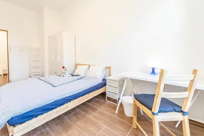 a small room with a bed and a window at YELLOW INN - SIMPLE ROOMS -- OLMA Messen & Autobahn 1 Min, HSG 6 Min, Spital 7min, günstige Parkplätze in St. Gallen